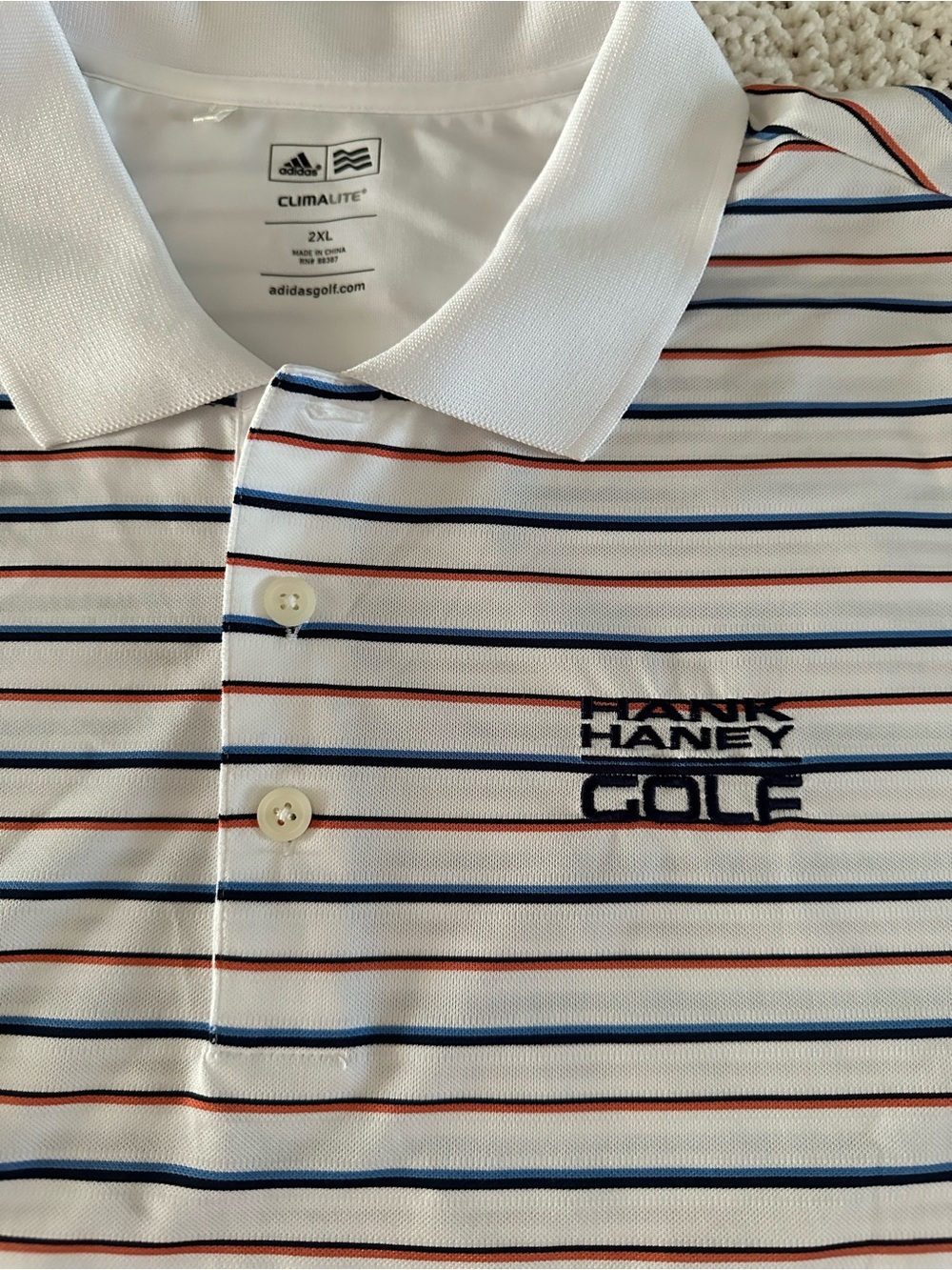 Adidas White Polo with Navy and Red Stripes - Hank Haney Golf